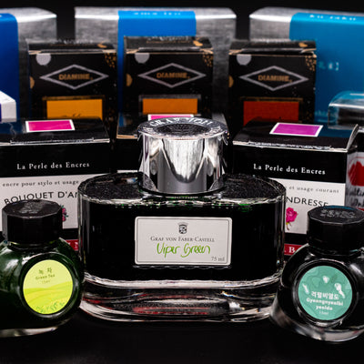Glass bottle of blue fountain pen ink from Faber Castel
