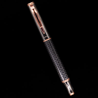 An overhead view of the Baoer Carbon Fire fountain pen capped.
