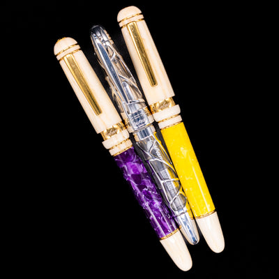An overhead view of 3 Laban fountain pens capped.