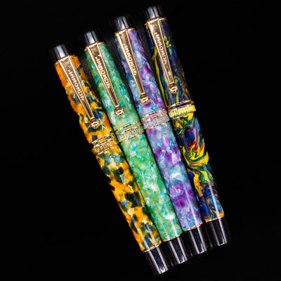 An overhead view of 4 LeBoeuf fountain pens capped.