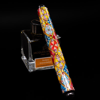 AP Limited Editions Imperial Lacquer Art Fountain Pen - Tiffany capped, leaning against an ink bottle. 