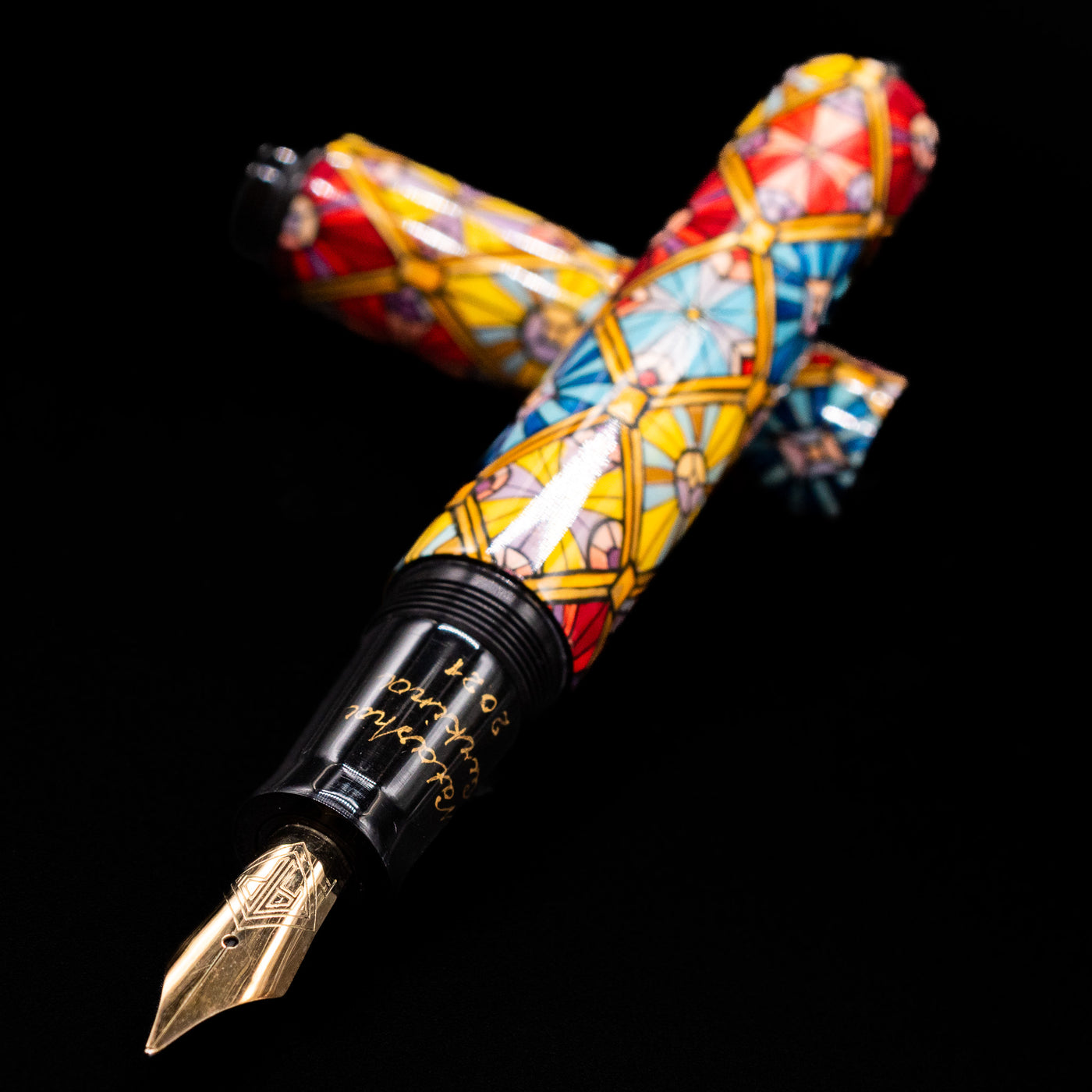 AP Limited Editions Imperial Lacquer Art Fountain Pen - Tiffany laying across its own cap, crossed, with a focus on the nib.