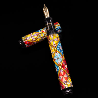 AP Limited Editions Imperial Lacquer Art Fountain Pen - Tiffany laying on top of its cap in a crossed position showing full view of the entire uncapped pen.