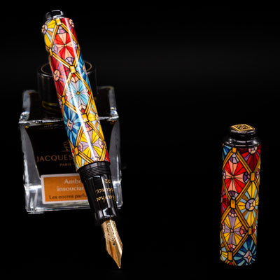 AP Limited Editions Imperial Lacquer Art Fountain Pen - Tiffany leaning on an ink bottle uncapped showcasing the detailing on the nib.