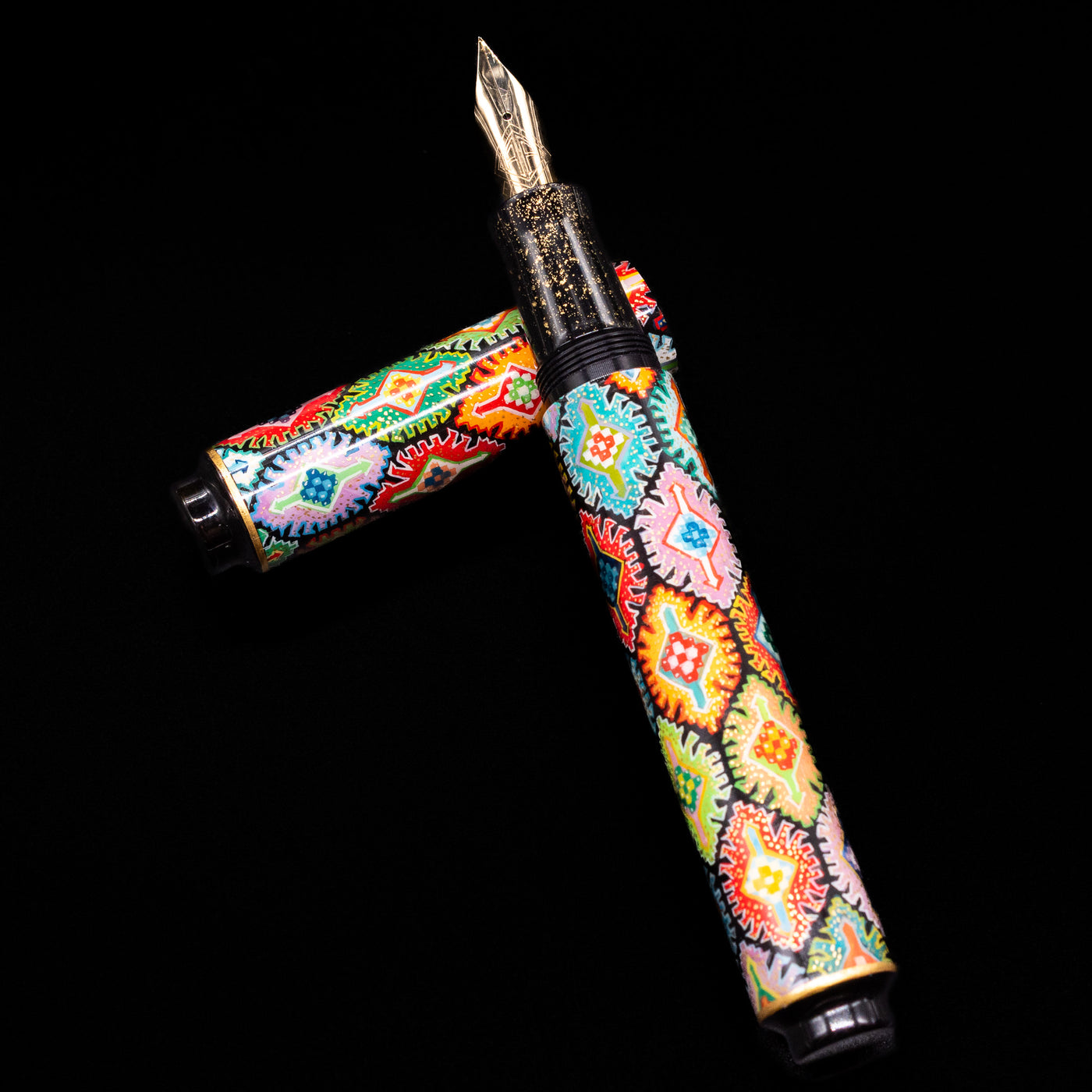 AP Limited Editions Imperial Lacquer Art Fountain Pen - Tutankhamen laying on top of its cap in a crossed position showing full view of the entire uncapped pen.