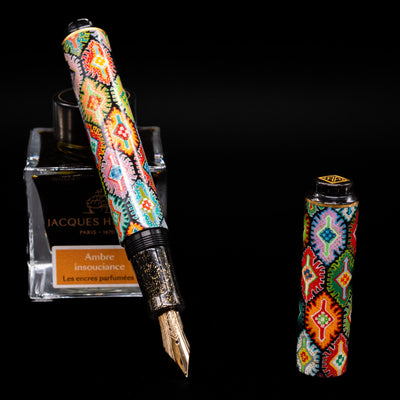 AP Limited Editions Imperial Lacquer Art Fountain Pen - Tutankhamen leaning on an ink bottle uncapped showcasing the detailing on the nib.