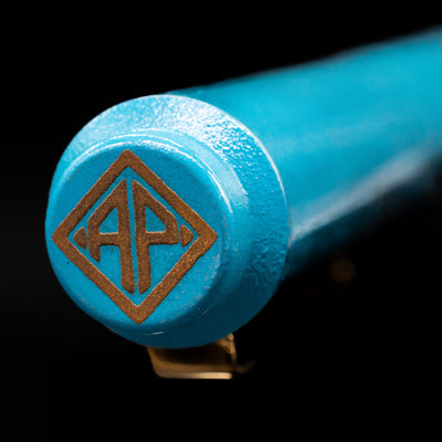 Zoomed-in view of the top of the cap with the finial on the AP Limited Editions Proplyd Aqua Fountain Pen.