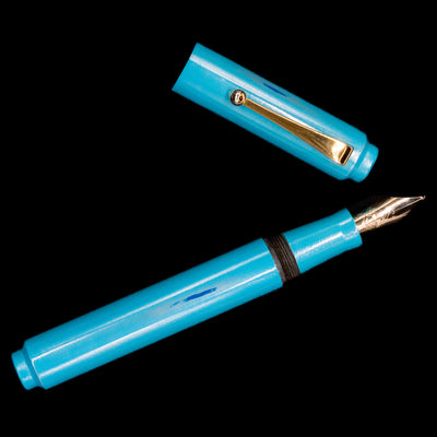 An overhead view of the AP Limited Editions Proplyd Aqua Fountain Pen uncapped.
