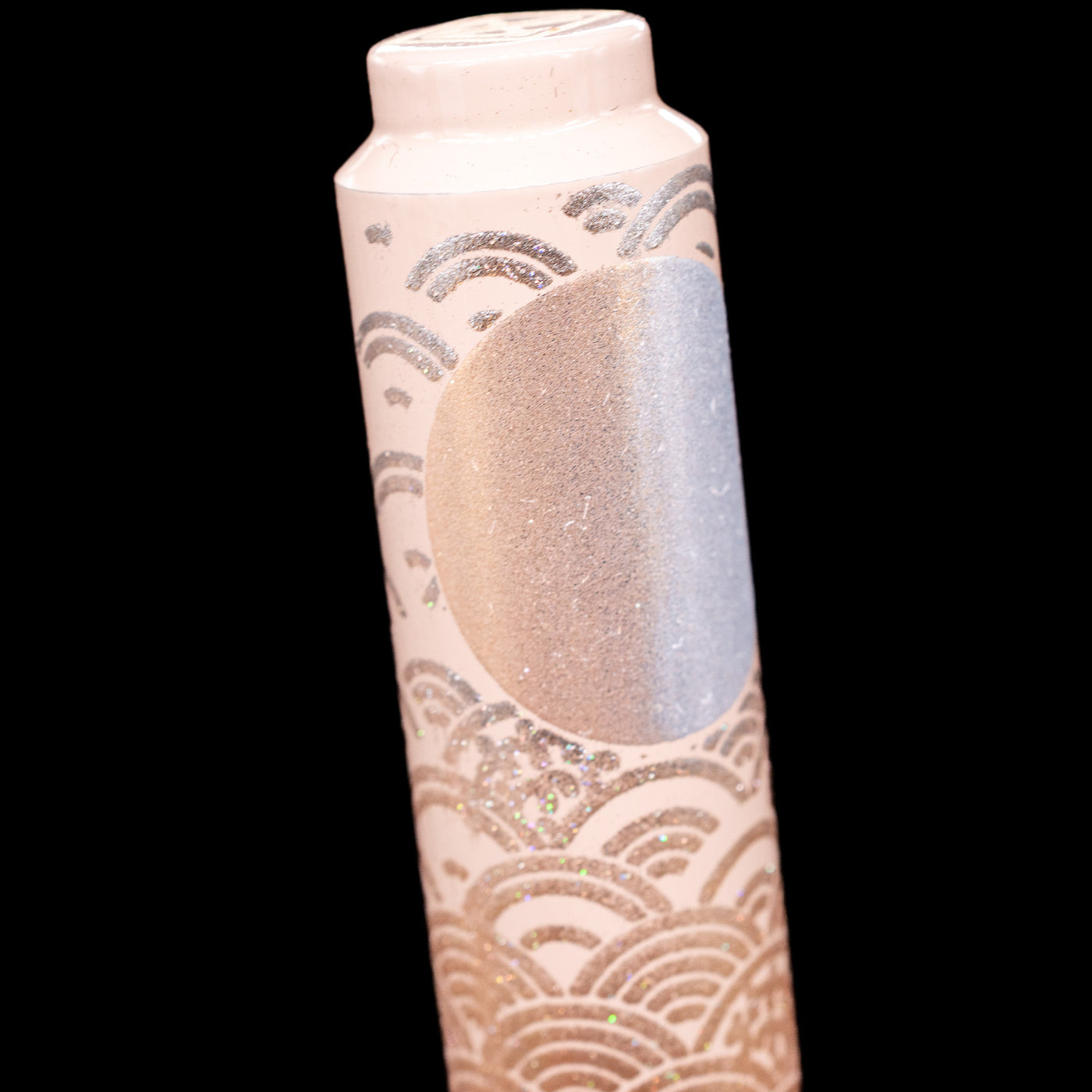 A close-up shot of the sun or moon on the top of the cap on the A detail shot of a blue-eared bunny on the AP Limited Editions Sakura Lacquer Art Fountain Pen - Rabbits in a Summer Garden.