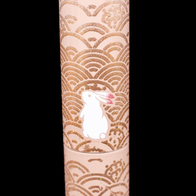 A detail shot of a pink-eared bunny on the AP Limited Editions Sakura Lacquer Art Fountain Pen - Rabbits in a Summer Garden.