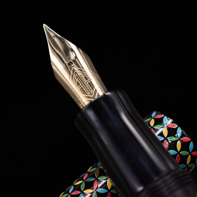 A macro shot of the nib with its intricate detailing and logo engraving for the AP Limited Editions Sakura Lacquer Art Fountain Pen - Rhythm.
