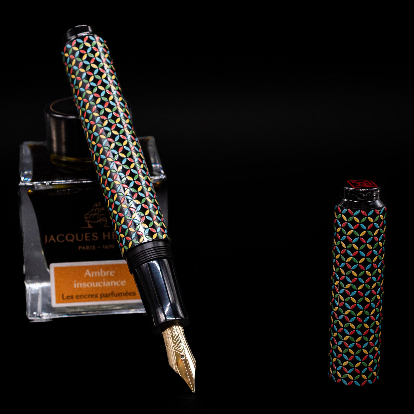AP Limited Editions Sakura Lacquer Art Fountain Pen - Rhythm leaning on an ink bottle uncapped showcasing the detailing on the nib.