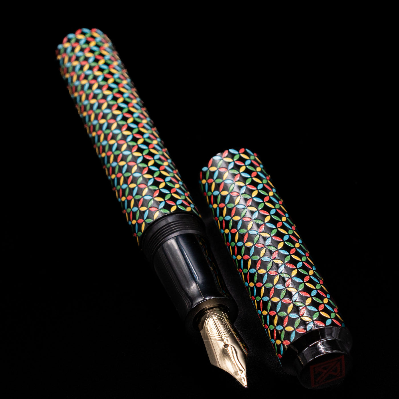 A full view of the AP Limited Editions Sakura Lacquer Art Fountain Pen - Rhythm uncapped, with its cap laying next to the pen. 