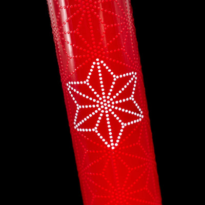 A detail shot of the white snowflake on the AP Limited Editions Sakura Lacquer Art Fountain Pen - Snowflakes Red.
