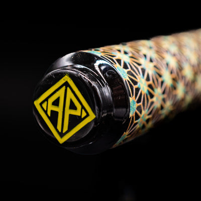 Zoomed-in view of the top of the cap with the finial on the AP Limited Editions Sakura Lacquer Art Fountain Pen - Teal Stars.