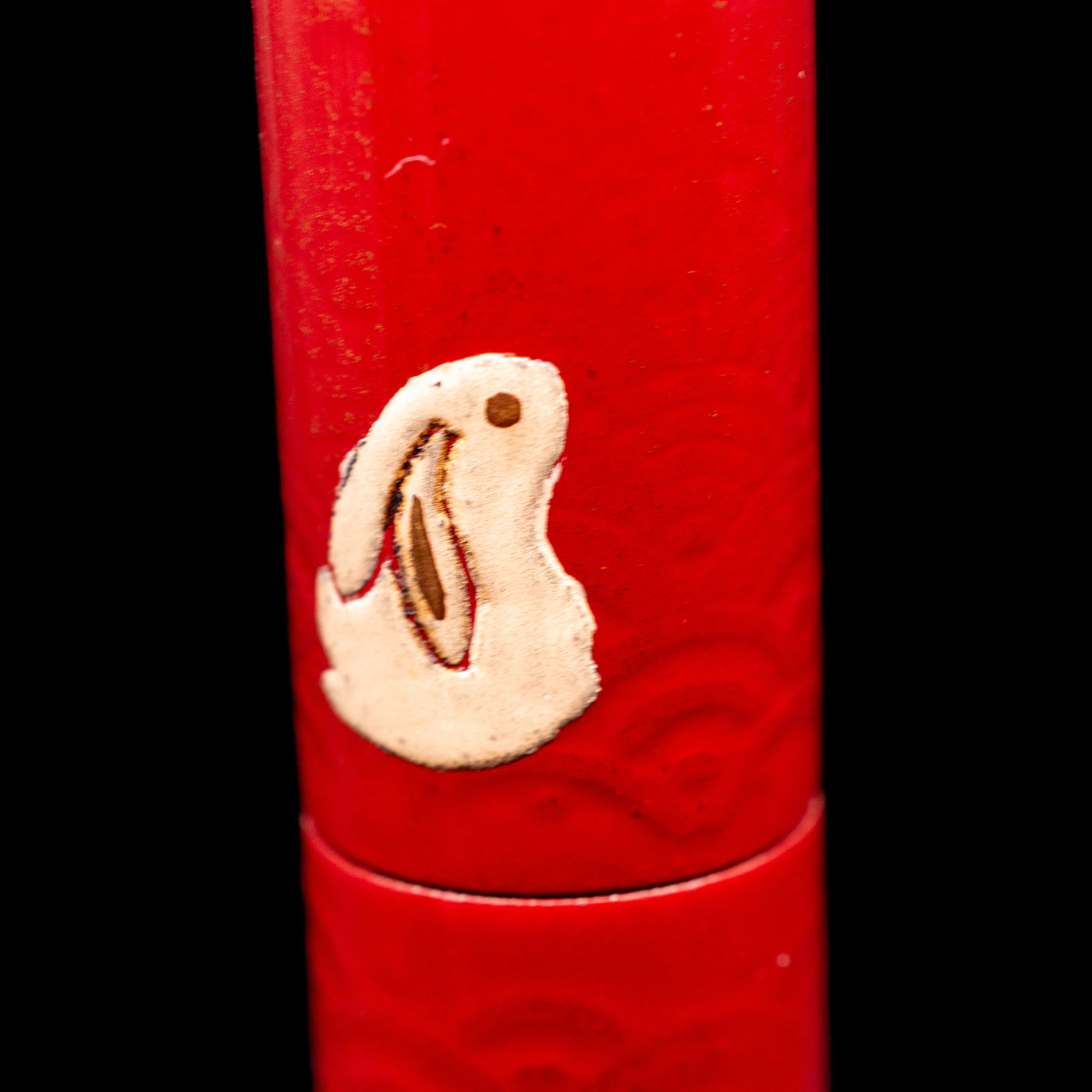 A macro shot of a sitting rabbit on the body of the AP Limited Editions Sakura Lacquer Art Fountain Pen - Year of the Rabbit.