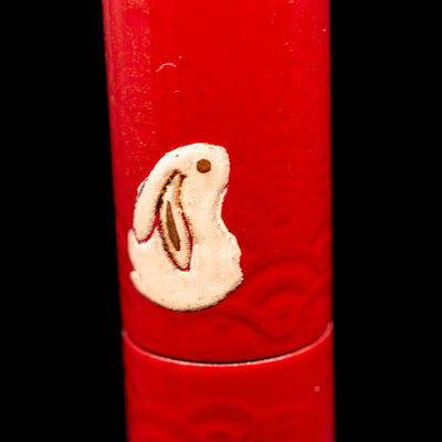 A macro shot of a sitting rabbit on the body of the AP Limited Editions Sakura Lacquer Art Fountain Pen - Year of the Rabbit.