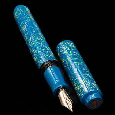  A full view of the AP Limited Editions Urushi Lacquer Art Fountain Pen - Blue Bliss uncapped, with its cap laying next to the pen. 