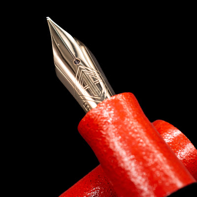 A macro shot of the nib with its intricate detailing and logo engraving for the AP Limited Editions Urushi Lacquer Art Fountain Pen - Colors of the Cosmos Aldebaran.
