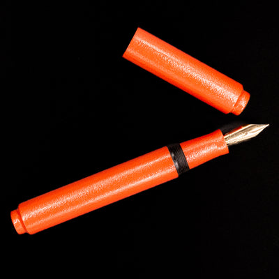 An overhead view of the AP Limited Editions Urushi Lacquer Art Fountain Pen - Colors of the Cosmos Aldebaran uncapped.