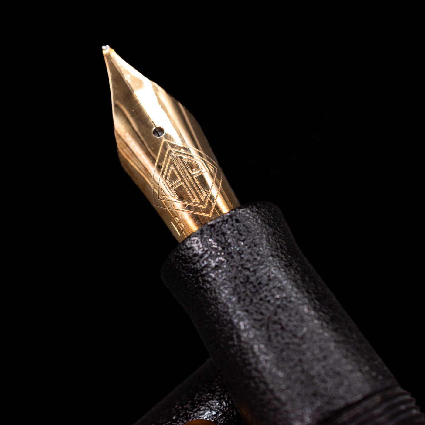 A macro shot of the nib with its intricate detailing and logo engraving for the AP Limited Editions Urushi Lacquer Art Fountain Pen - Ishiji Black & Gold.
