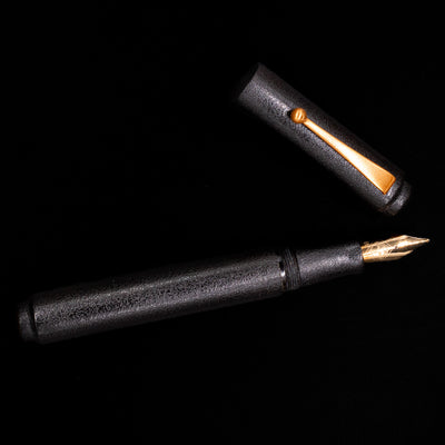 An overhead view of the AP Limited Editions Urushi Lacquer Art Fountain Pen - Ishiji Black & Gold uncapped.
