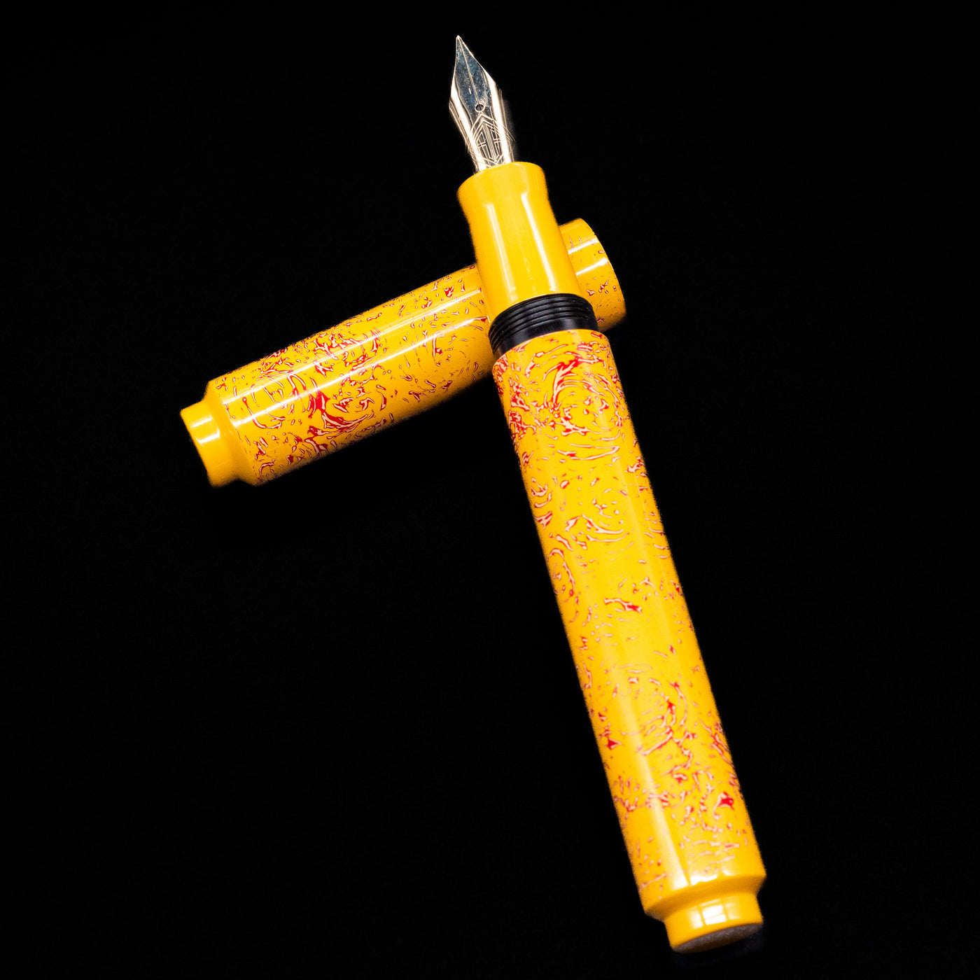 AP Limited Editions Urushi Lacquer Art Fountain Pen - Sunshine laying on top of its cap in a crossed position showing full view of the entire uncapped pen.