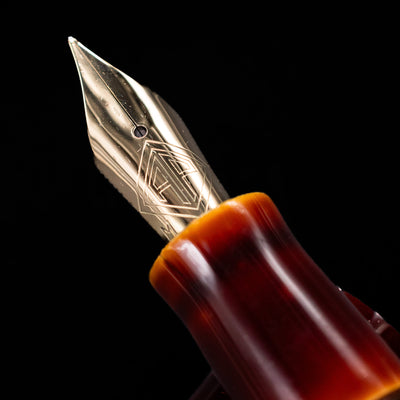 A macro shot of the nib with its intricate detailing and logo engraving for the AP Limited Editions Urushi Lacquer Art Fountain Pen - Tamenuri Yellow.