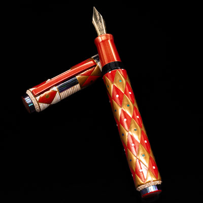 AP Limited Editions Writer Maki-e Fountain Pen - Aogai Deco laying on top of its cap in a crossed position showing full view of the entire uncapped pen.