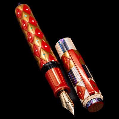 A full view of the AP Limited Editions Writer Maki-e Fountain Pen - Aogai Deco uncapped, with its cap laying next to the pen. 