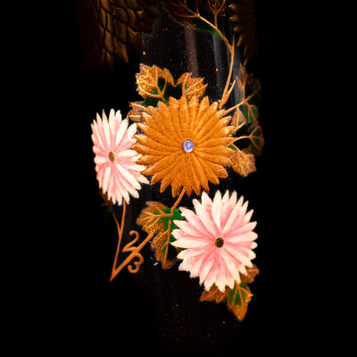 A macro shot of flowers on the AP Limited Editions Writer Maki-e Fountain Pen - Chrystanthemum (Prototype).