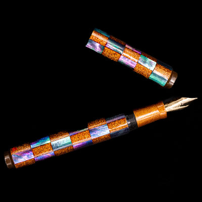 An overhead view of the AP Limited Editions Writer Maki-e Fountain Pen - Sparkle uncapped.