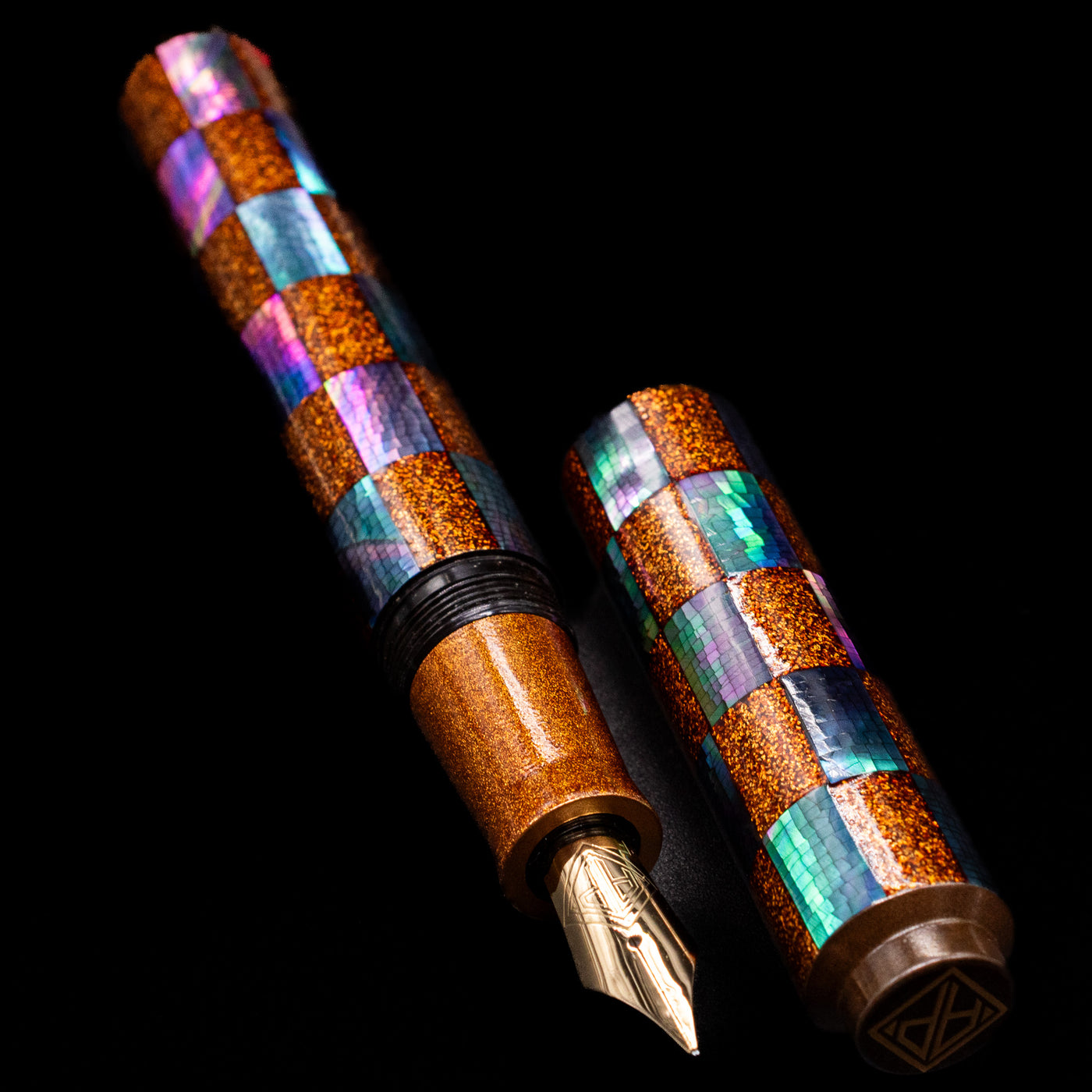  A full view of the AP Limited Editions Writer Maki-e Fountain Pen - Sparkle uncapped, with its cap laying next to the pen. 