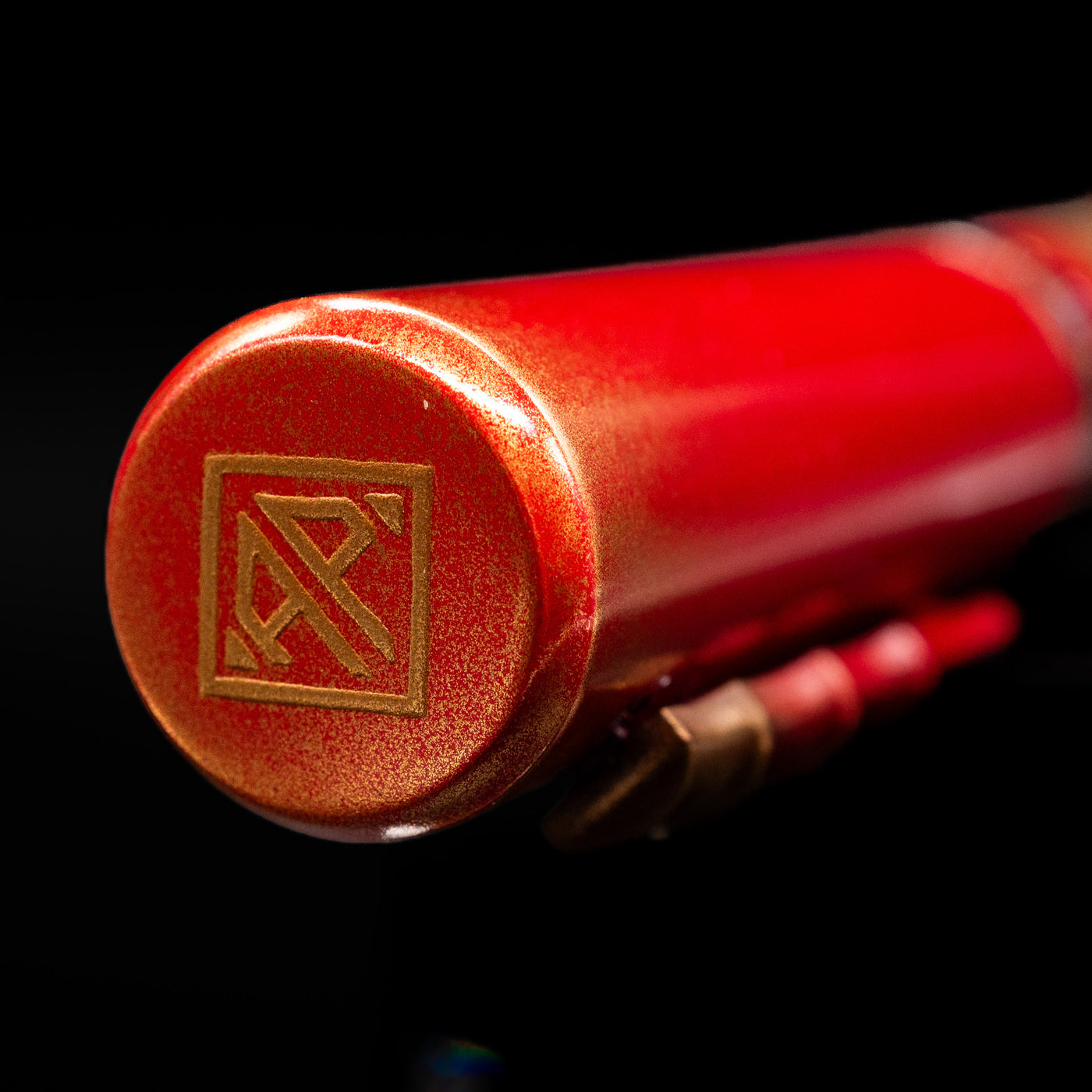 Zoomed-in view of the top of the cap with the finial on the AP Limited Editions Writer Maki-e Fountain Pen - The Celebrated Dragon.