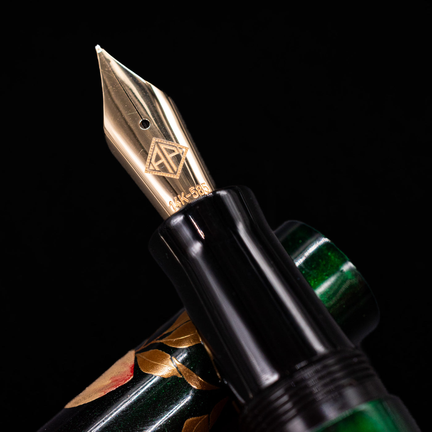 A macro shot of the nib with its intricate detailing and logo engraving for the AP Limited Editions Writer Maki-e Fountain Pen - The Parrot with Peaches.