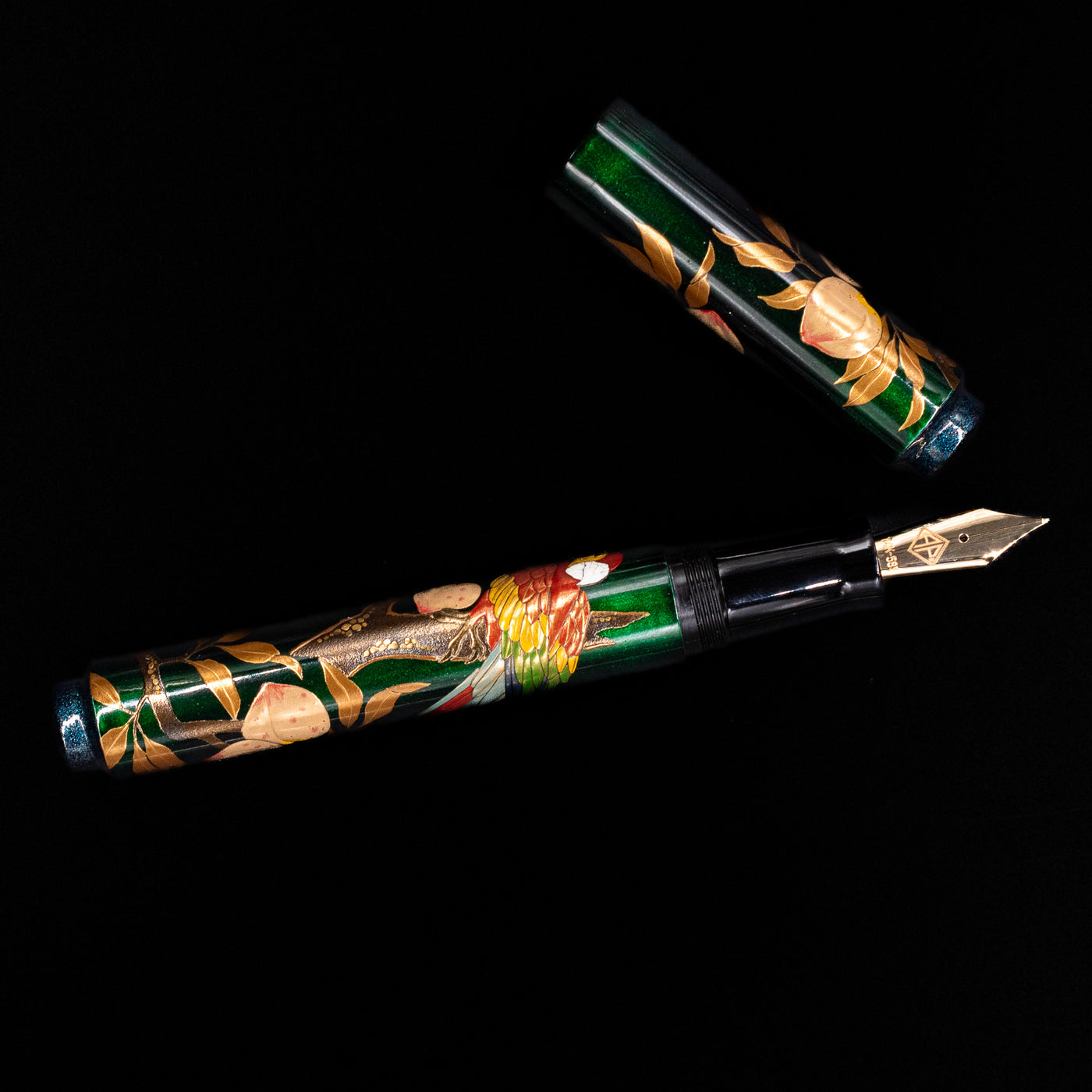 An overhead view of the AP Limited Editions Writer Maki-e Fountain Pen - The Parrot with Peaches uncapped.