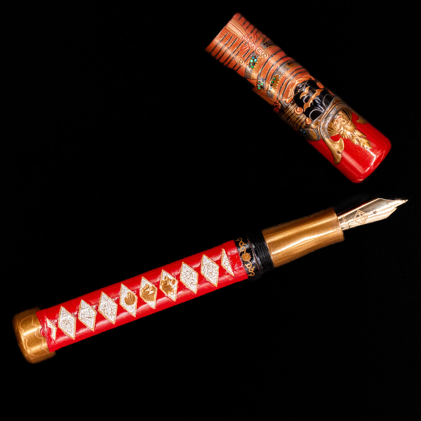 An overhead view of the AP Limited Editions Writer Maki-e Fountain Pen - The Pride of Samurai uncapped.