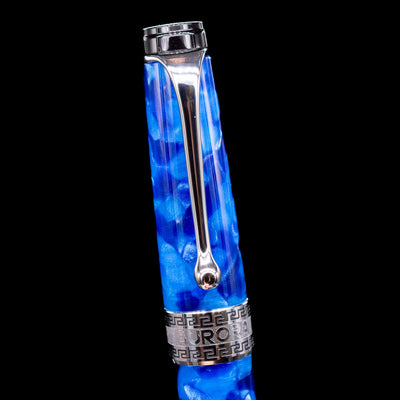 Close-up of the cap and clip of the Aurora Optima Auroloide Blue & Chrome fountain pen, highlighting the polished rhodium-plated clip, decorative engraved cap band, and the rich marbled blue resin finish.