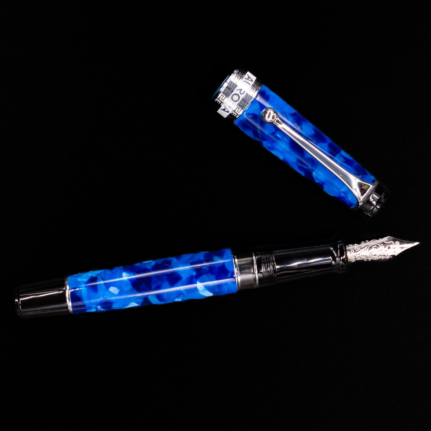 Overhead view of the Aurora Optima Auroloide Blue & Chrome fountain pen, emphasizing the balanced proportions, engraved cap band, and polished silver clip.