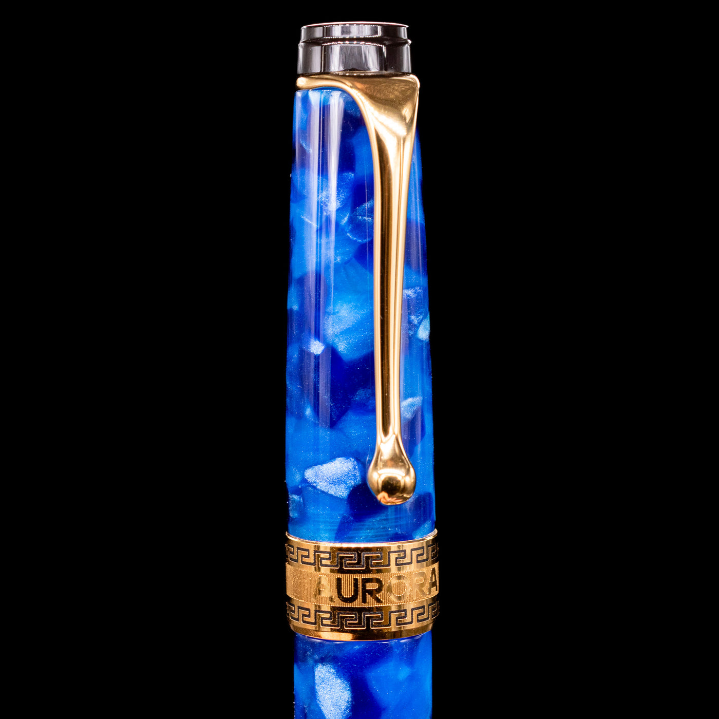 Close-up of the cap and clip of the Aurora Optima Auroloide Blue & Gold fountain pen, highlighting the polished gold-plated clip, decorative engraved cap band, and the rich marbled blue resin finish.