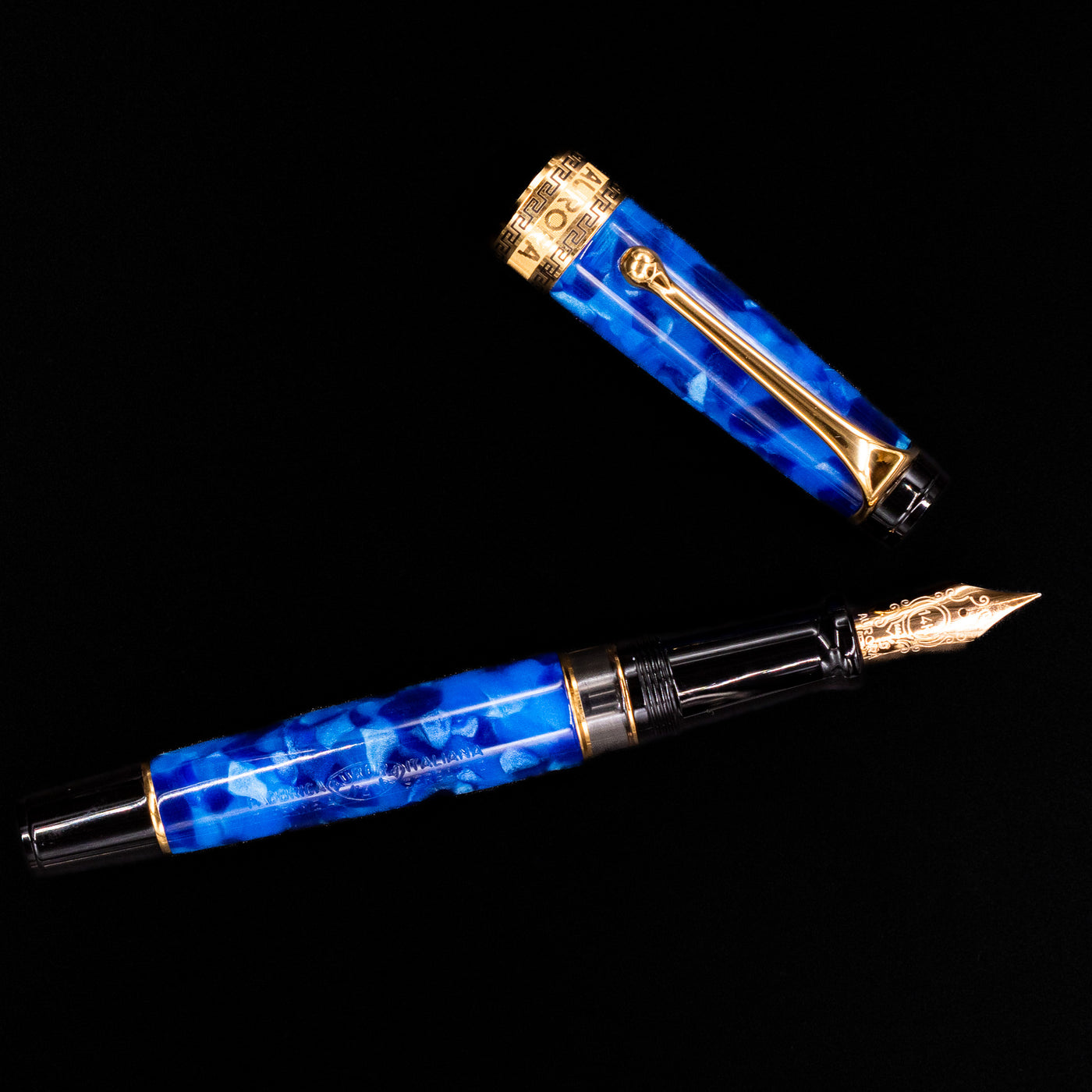 Overhead view of the Aurora Optima Auroloide Blue & Gold fountain pen, emphasizing the balanced proportions, engraved cap band, and polished gold clip.