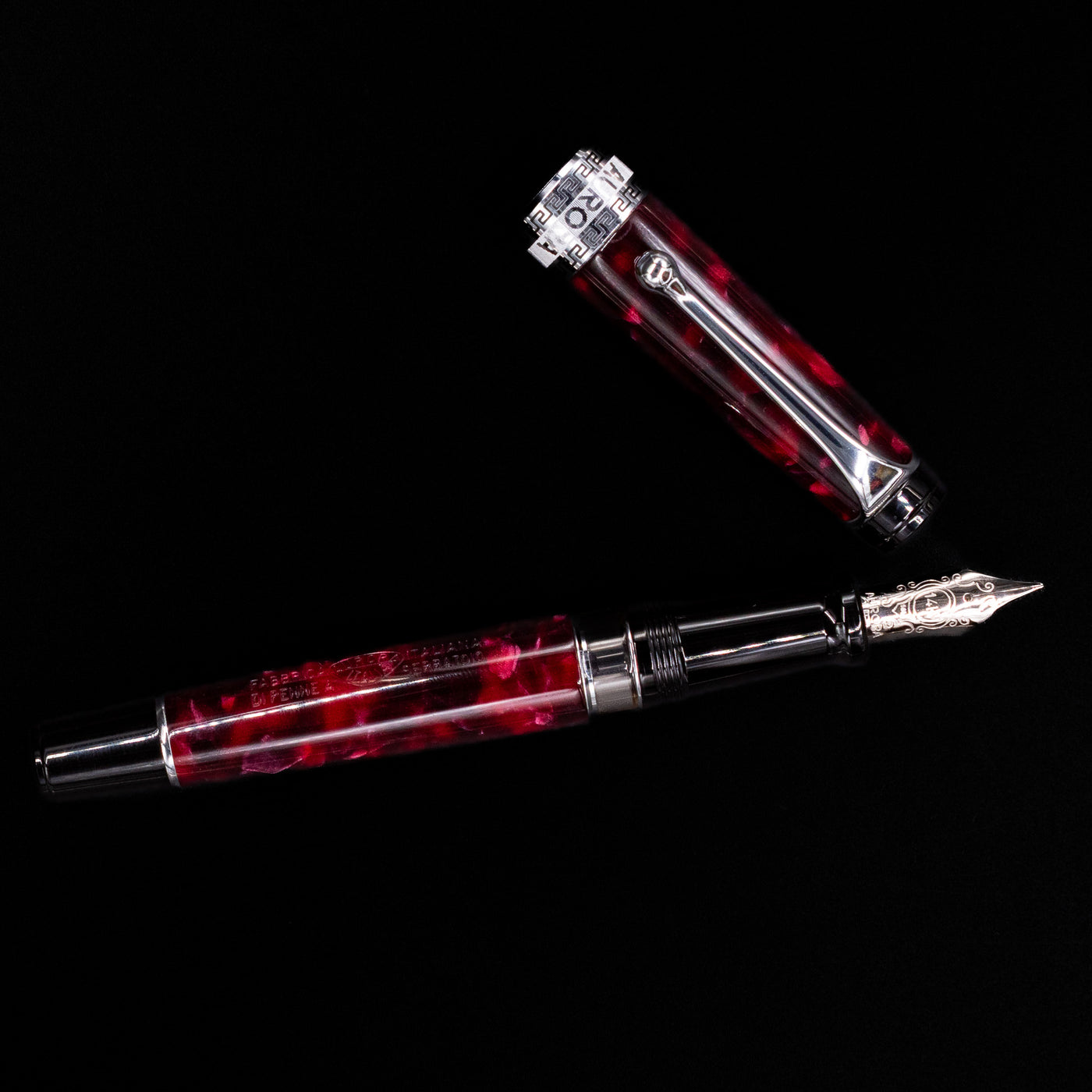Overhead view of the Aurora Optima Auroloide Burgundy fountain pen, emphasizing the balanced proportions, engraved cap band, and polished silver clip.