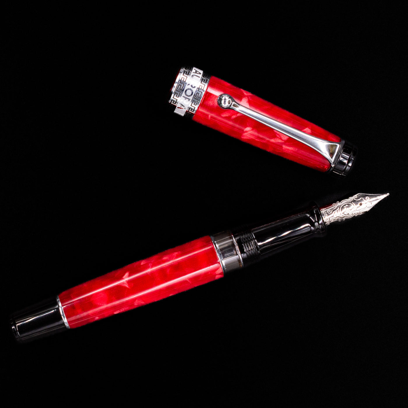 Overhead view of the Aurora Optima Auroloide Rossa fountain pen, emphasizing the balanced proportions, engraved cap band, and polished silver clip.