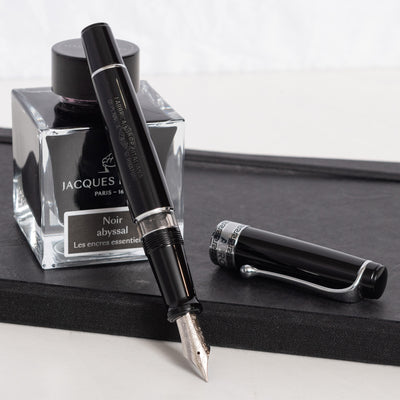 Aurora Optima Black Resin & Chrome Fountain Pen uncapped