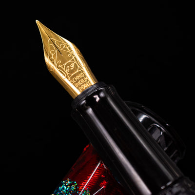 A macro shot of the nib with its intricate detailing and logo engraving for the BENU Briolette Fountain Pen - Ruby Forest.