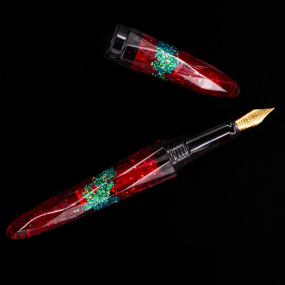An overhead view of the BENU Briolette Fountain Pen - Ruby Forest uncapped.