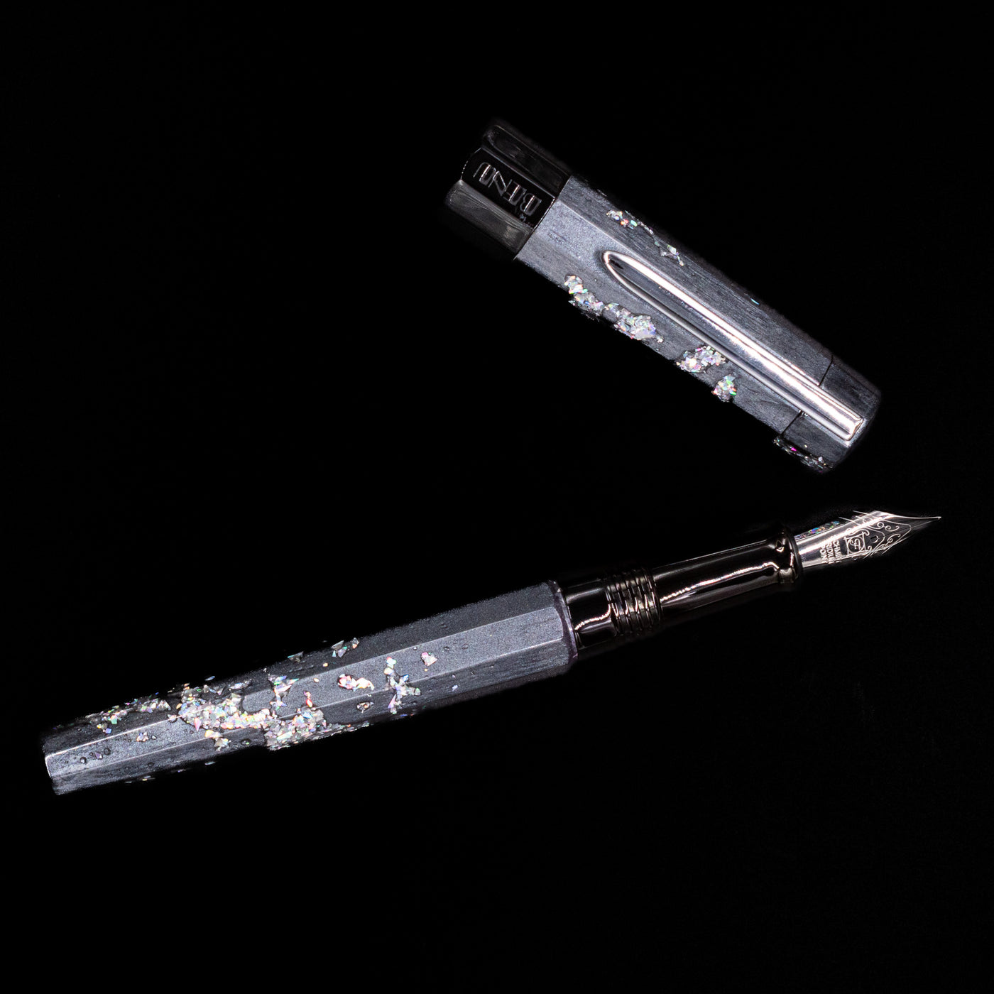An overhead view of the BENU Euphoria Caviar Fountain Pen uncapped.