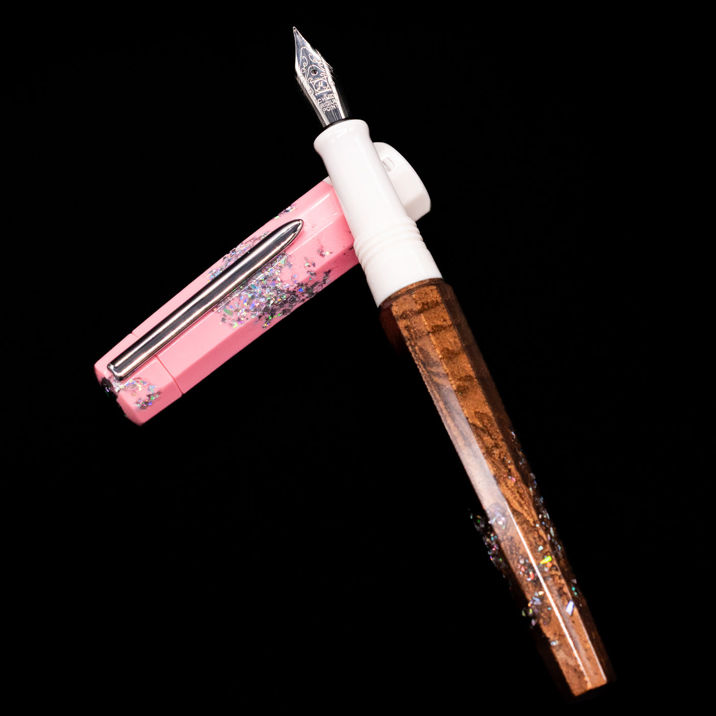BENU Euphoria Neapolitan Ice Cream Fountain Pen - Preowned laying on top of its cap in a crossed position showing full view of the entire uncapped pen.