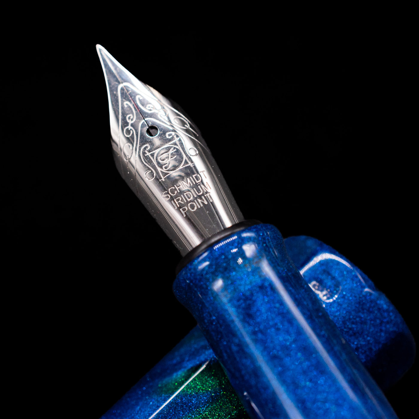 A macro shot of the nib with its intricate detailing and logo engraving for the BENU Euphoria White Stag Fountain Pen.