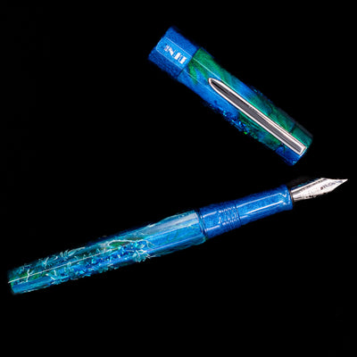 An overhead view of the BENU Euphoria White Stag Fountain Pen uncapped.